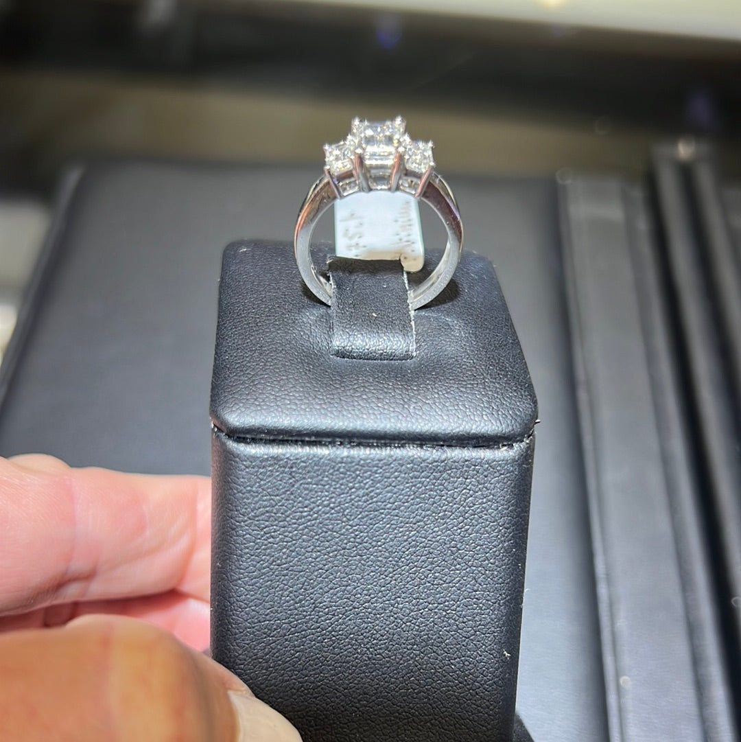 better side view of  an elegant 1.75 ct emerald cut diamond set in a sleek platinum ring