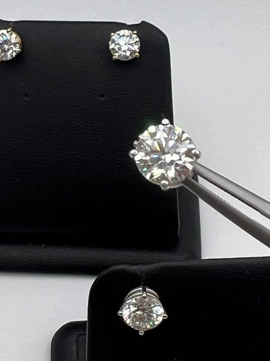 These are not the actual 3.0 ctw Diamond Earrings shine with two perfectly matched 1.5 ct round diamonds, nestled in timeless four-prong white gold settings 