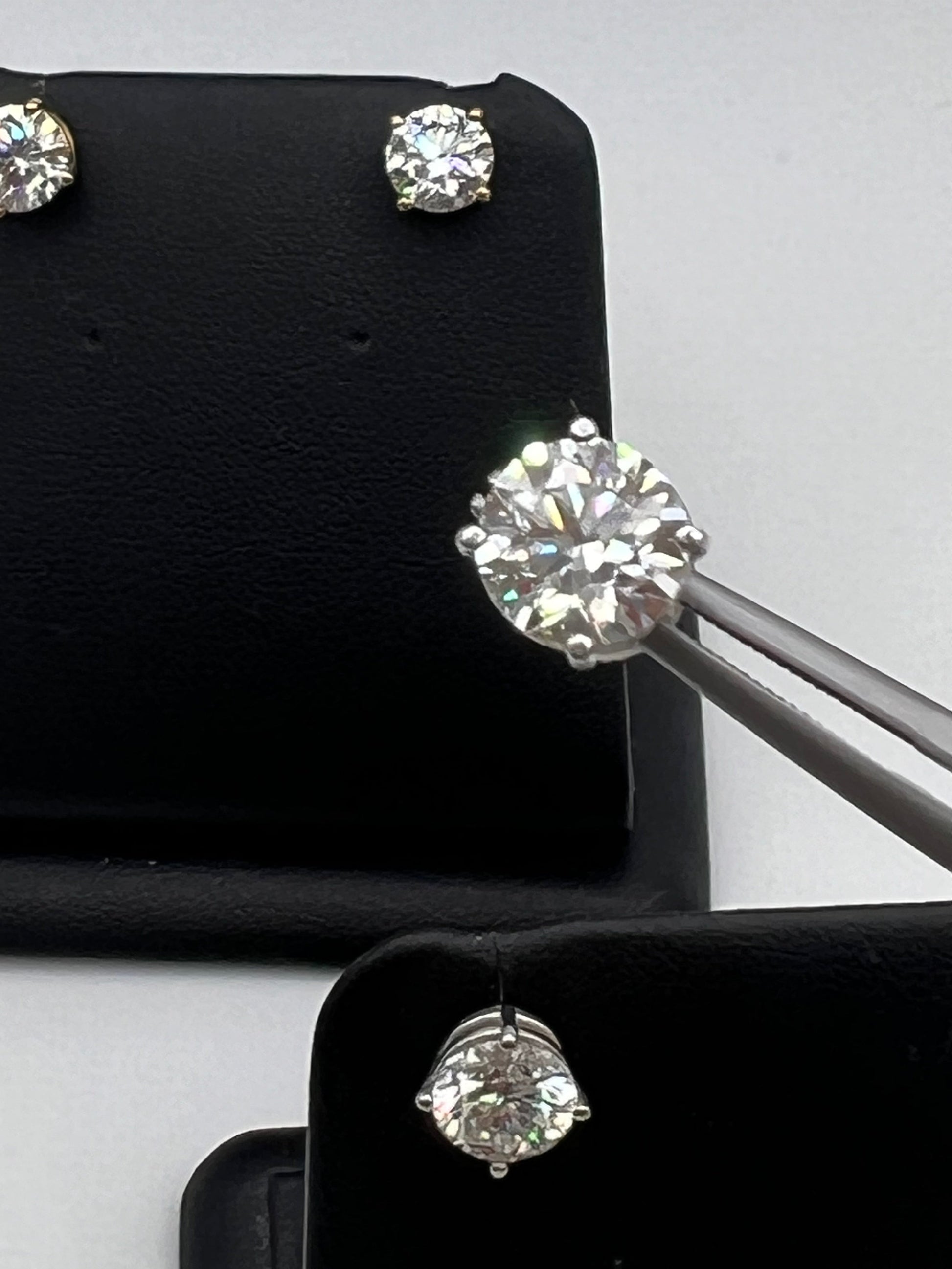 These are not the actual 3.0 ctw Diamond Earrings shine with two perfectly matched 1.5 ct round diamonds, nestled in timeless four-prong white gold settings 